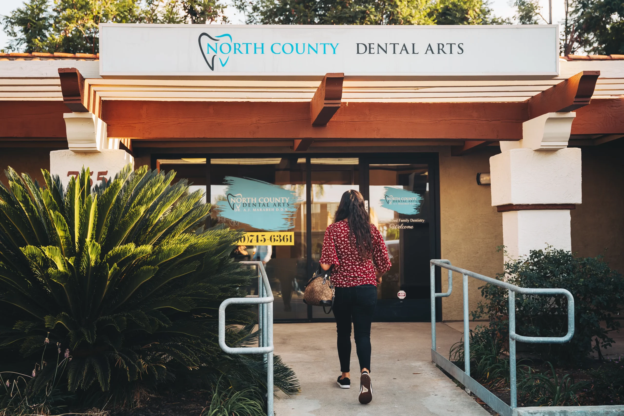 Patient walking up to the entrance of North County Dental Arts