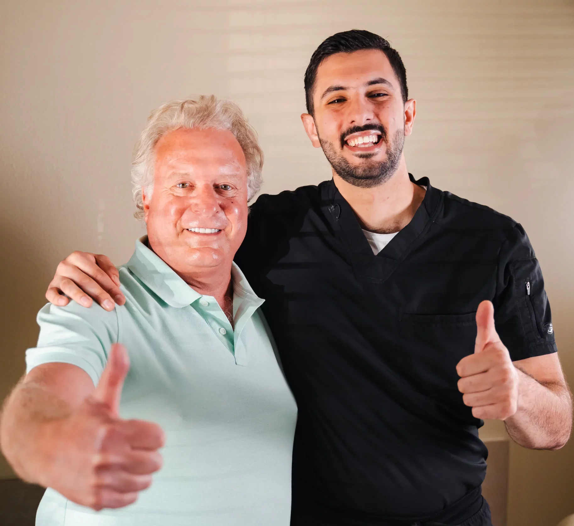 Happy patient and dentist celebrating successful treatment in Escondido dental office