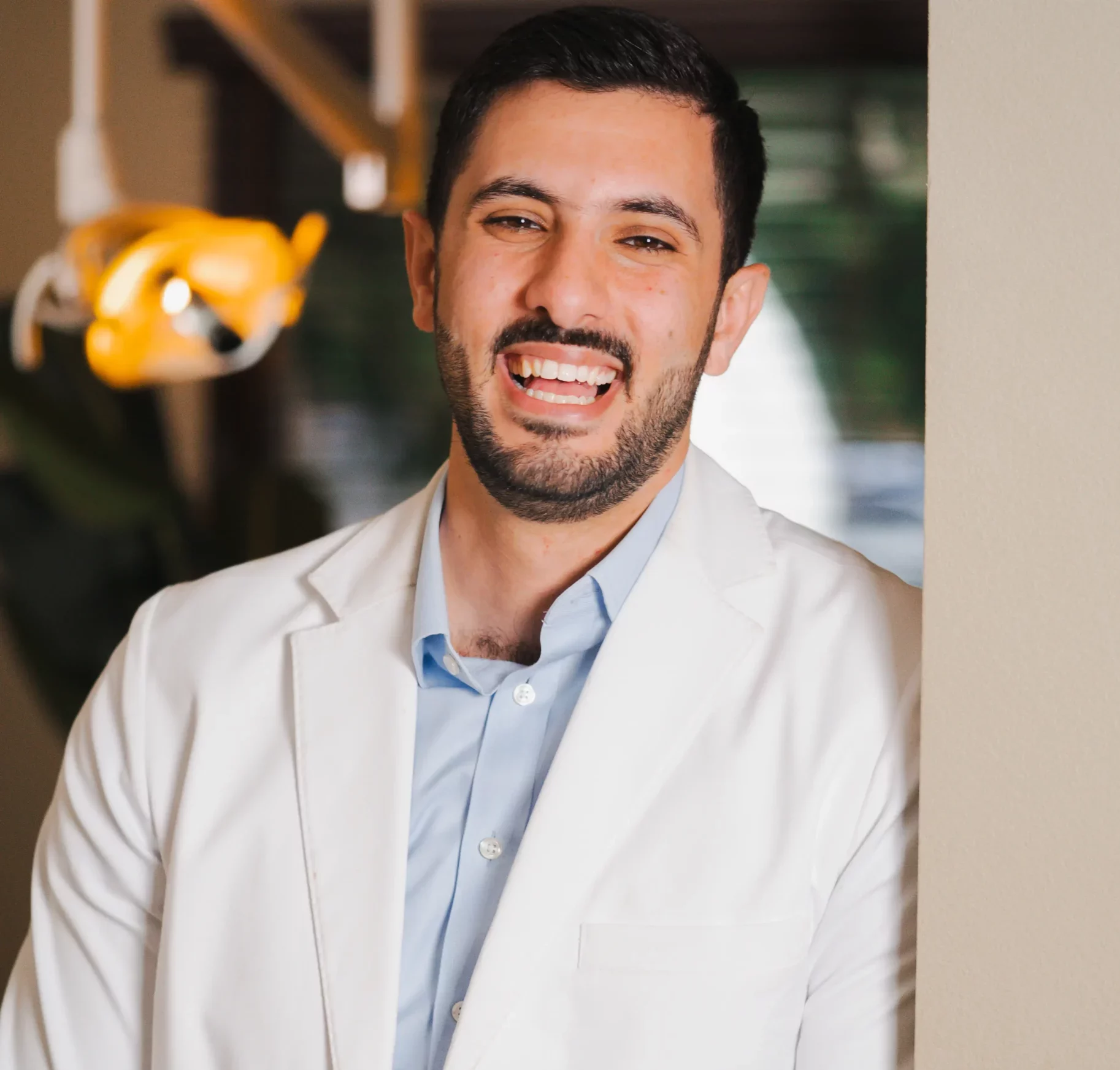 Dr. AJ Marabeh smiling in his white coat